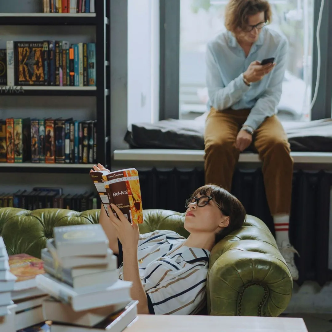 Sad girl with books