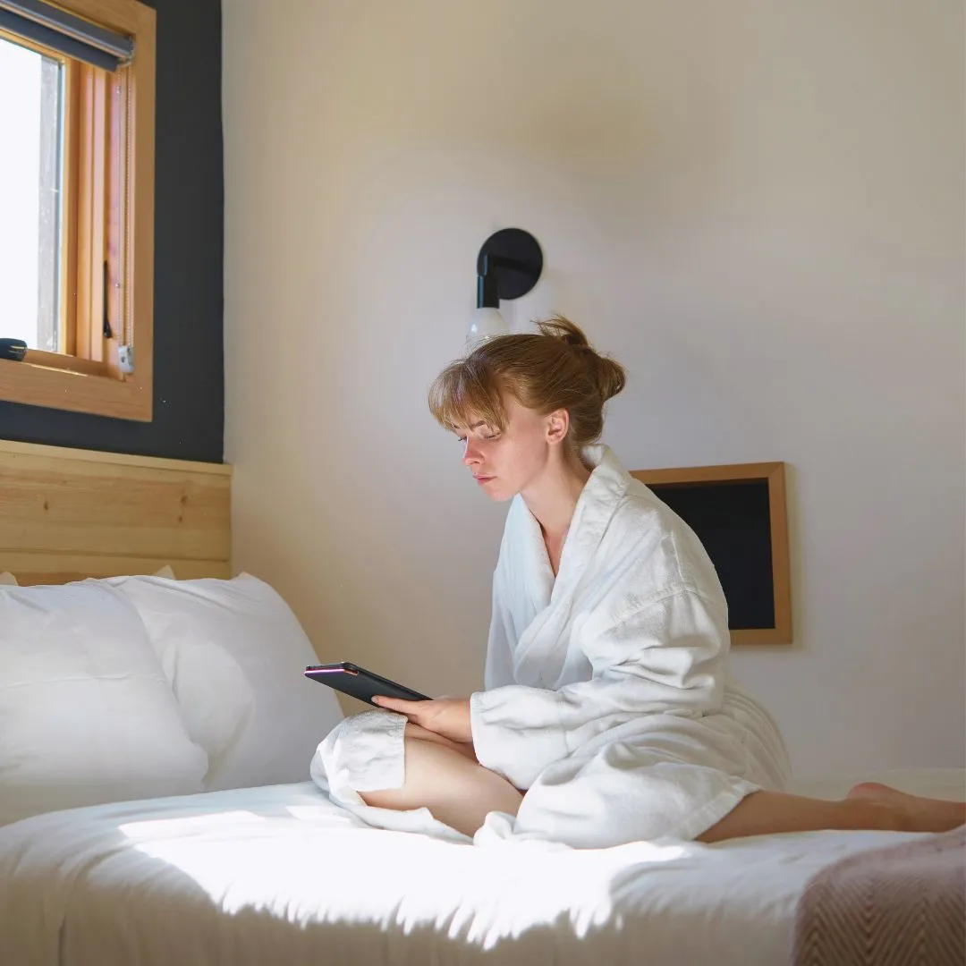 a girl reading in bed