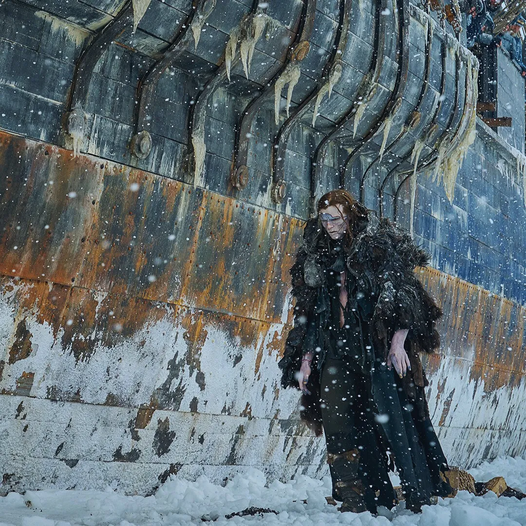 the Creature walking away from the ship that has Frankenstein