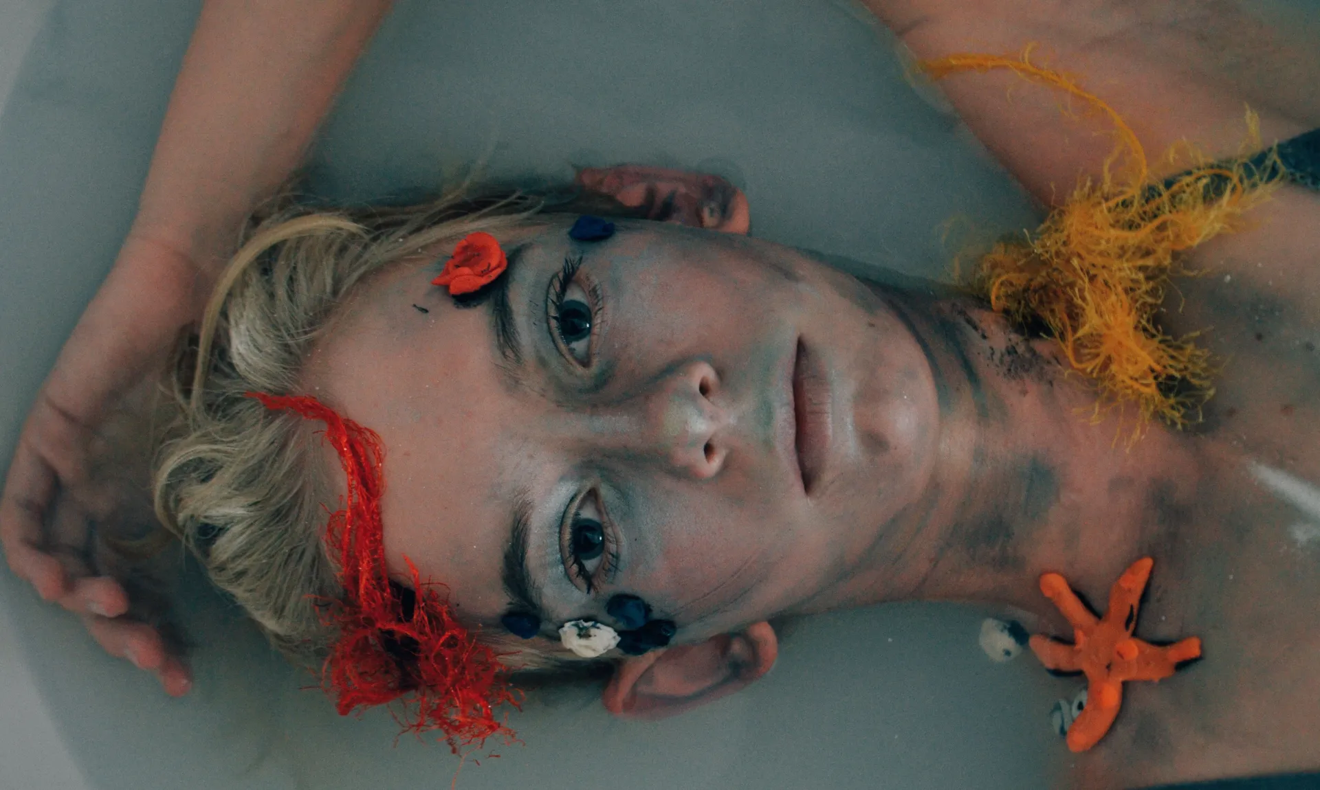 girl lying in bath tub representing past wounds and trauma