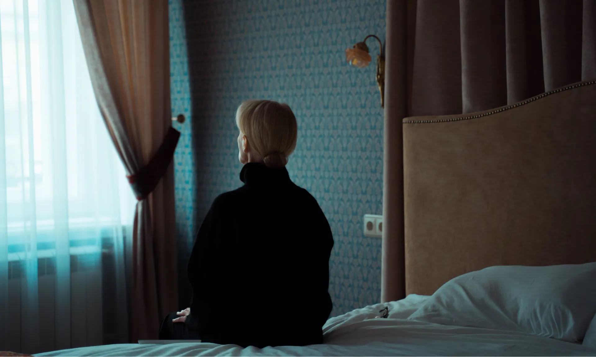 sad woman sitting alone representing loneliness