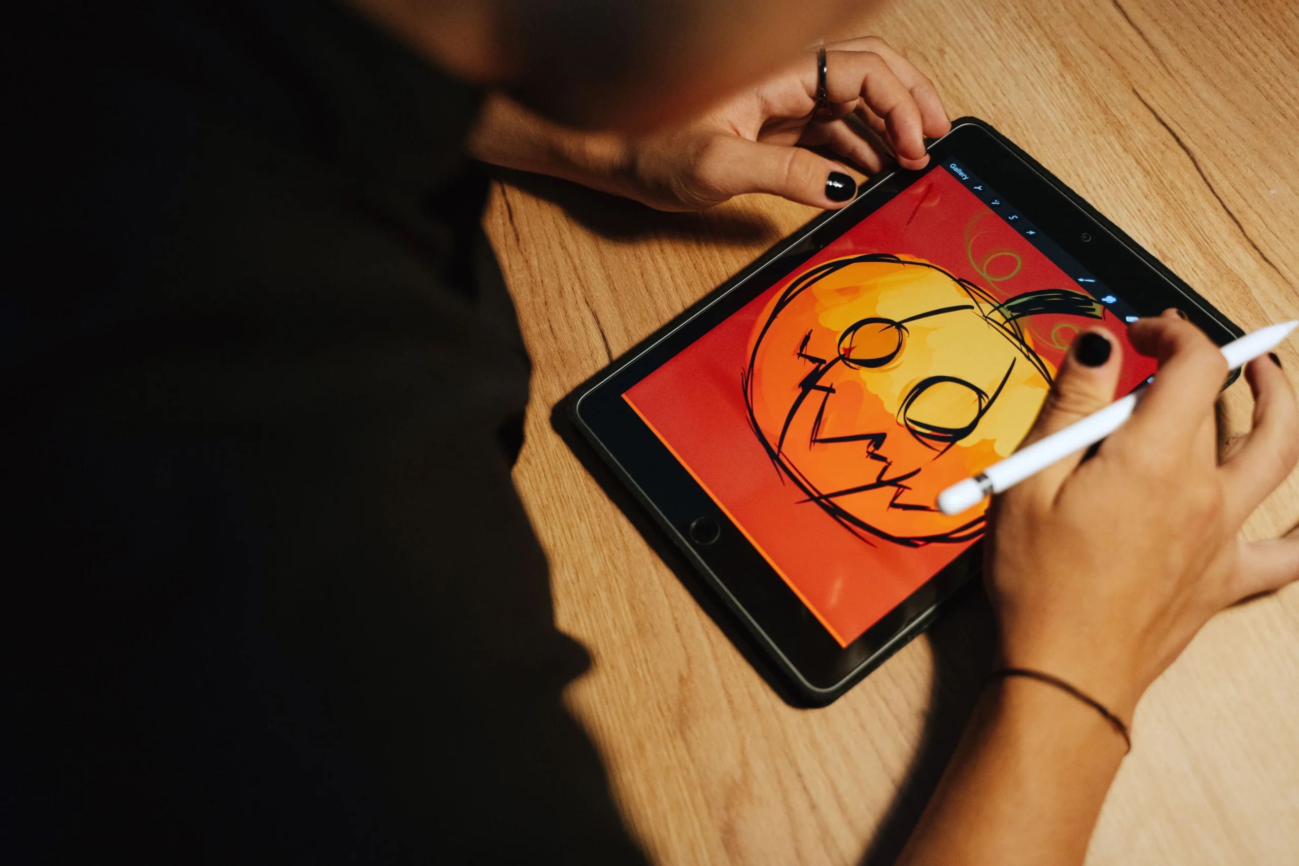 a tablet showing scary halloween pumpkin